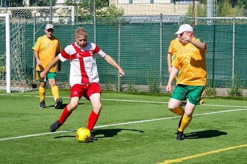 adults playing sports with a prosthetic eye