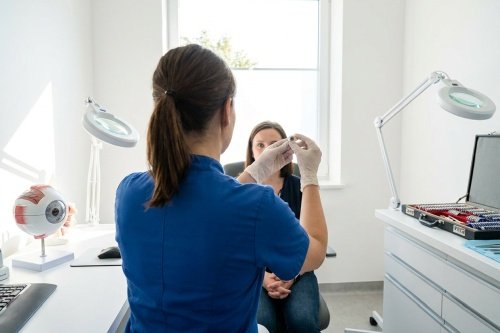 ocularist and patient at prosthetic eye aftercare appointment
